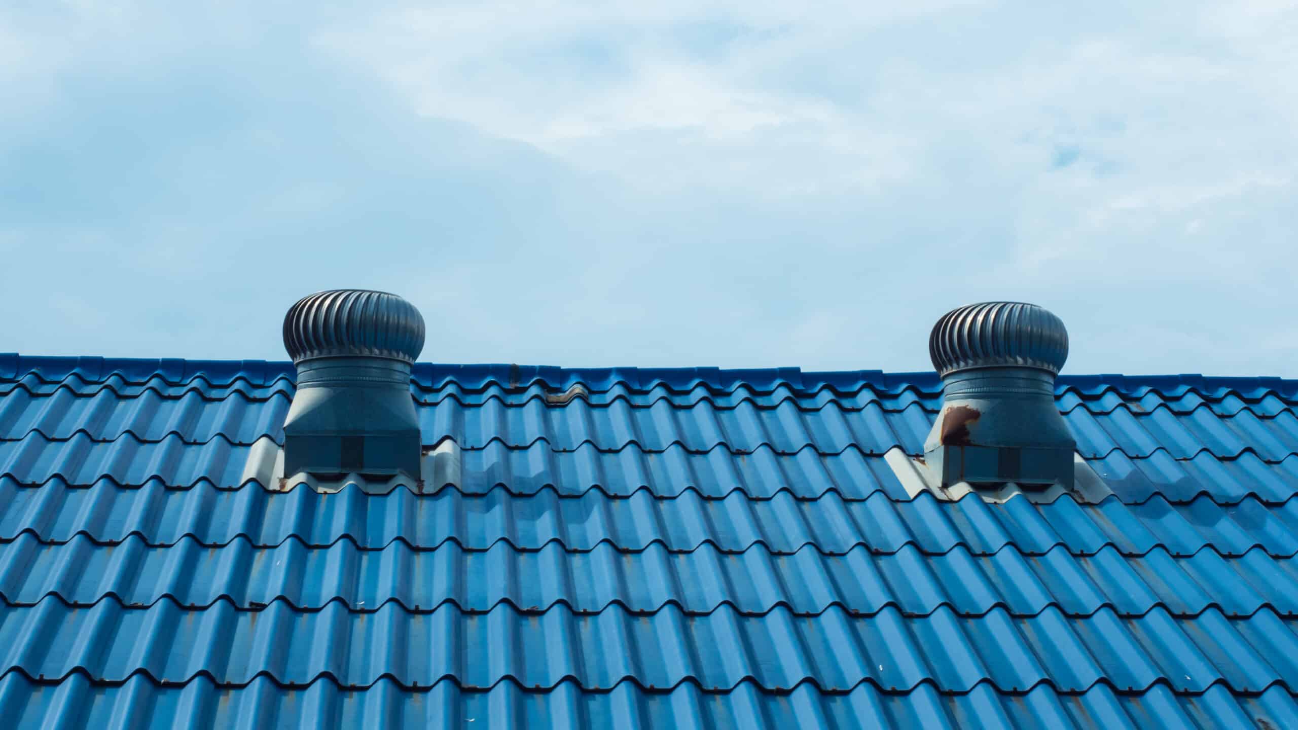 Vents on a metal shingled roof.