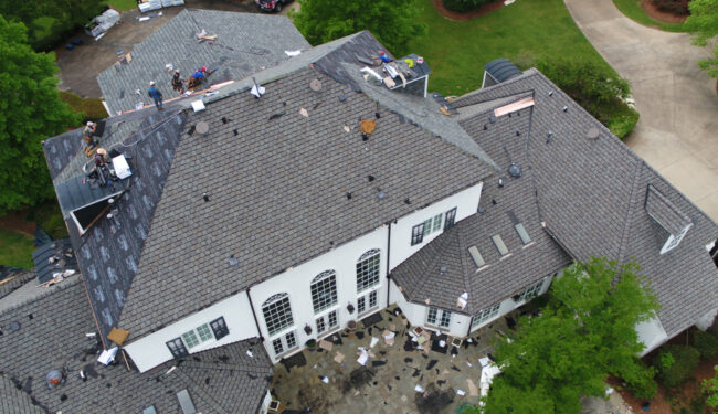 Aerial photo of large home getting a new roof.